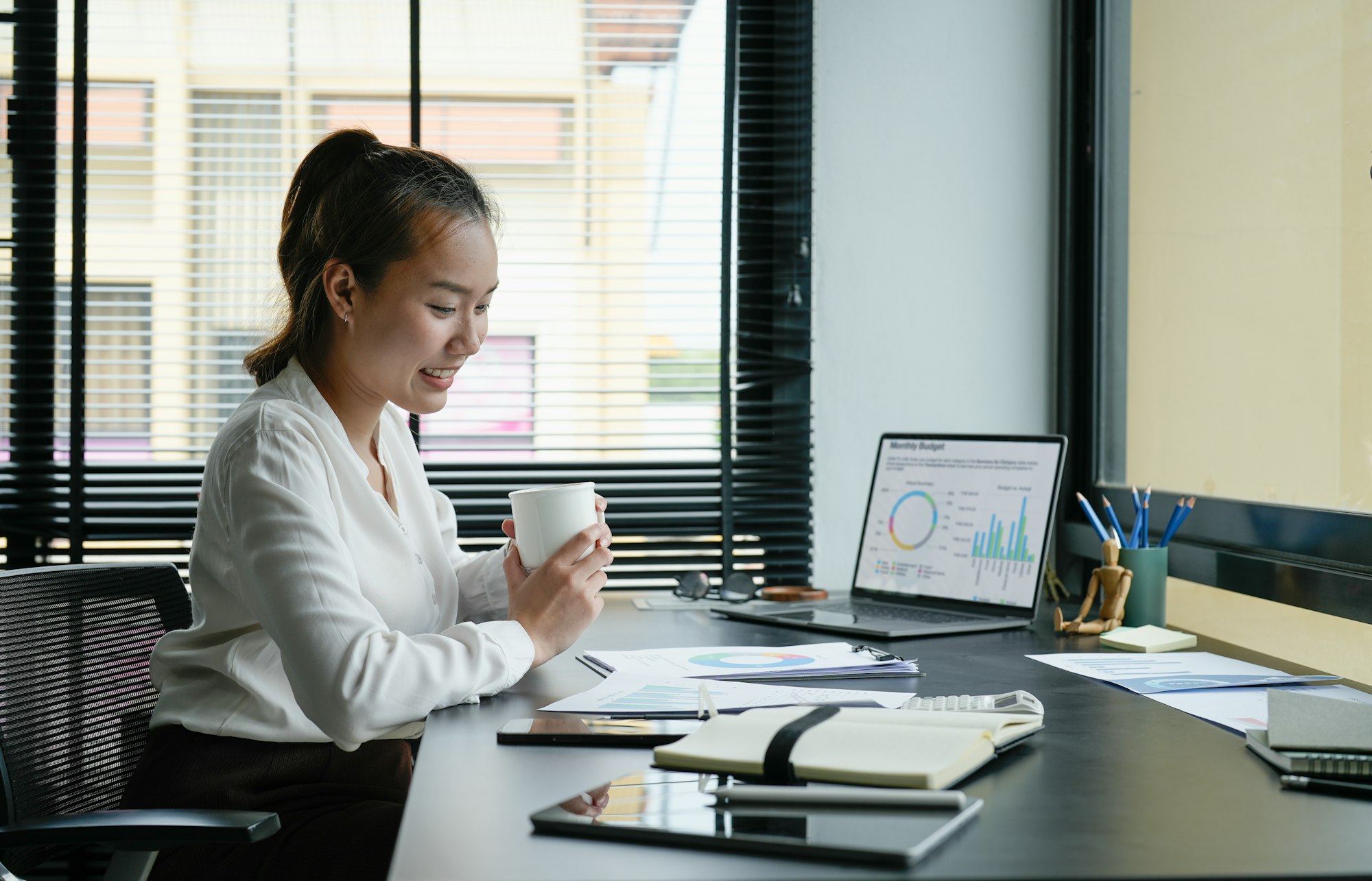 Business accountant asian woman analysis financial report at her office