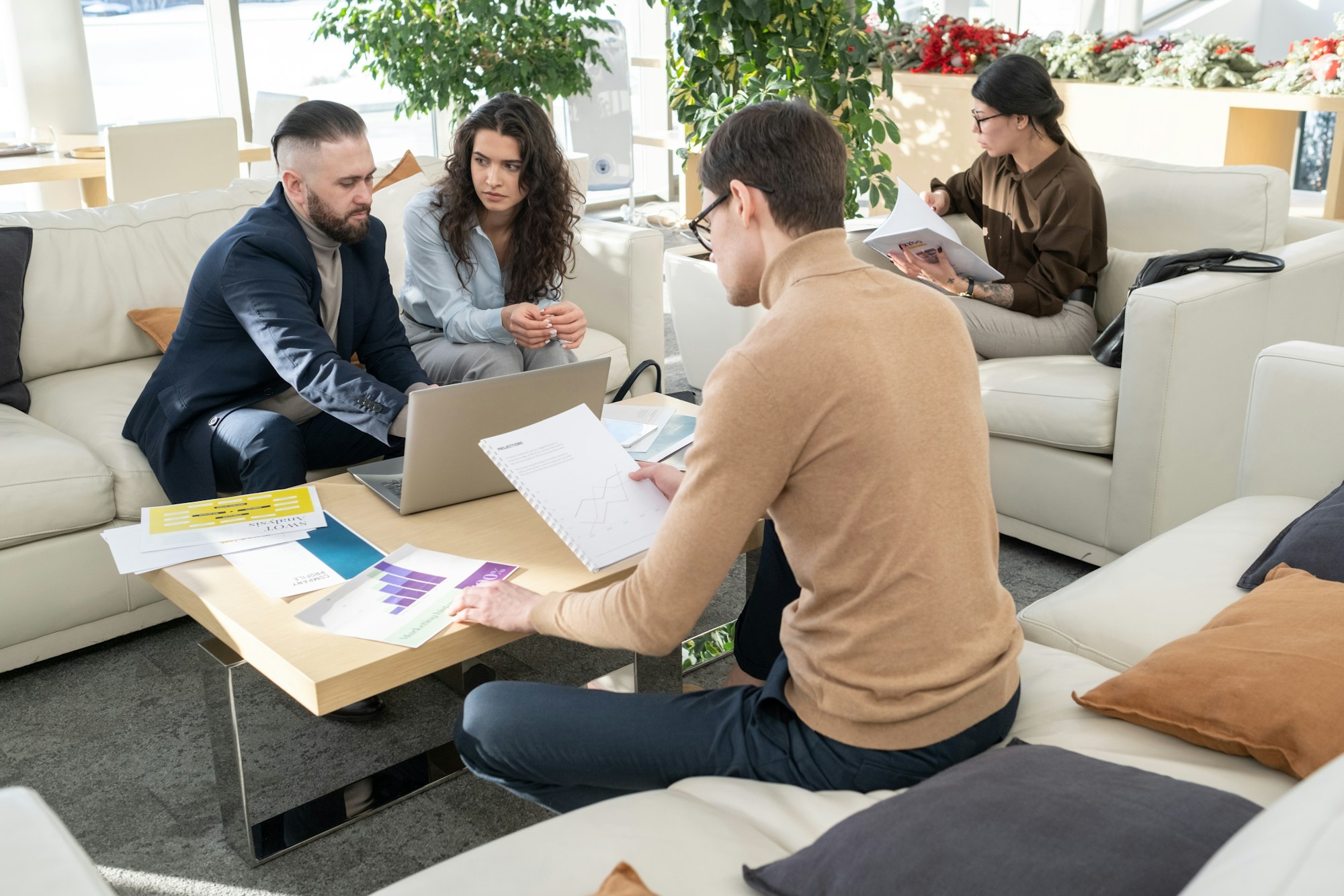 Young manager of modern company analyzing data in documents