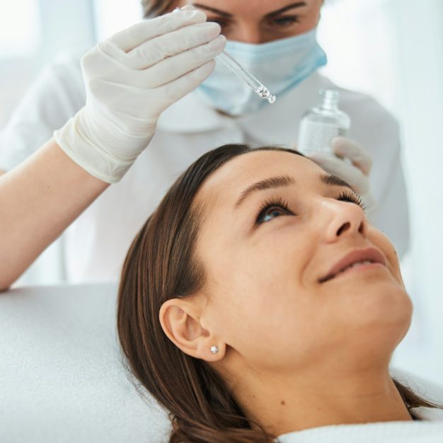 Woman undergoing a cosmetic procedure in a beauty spa salon